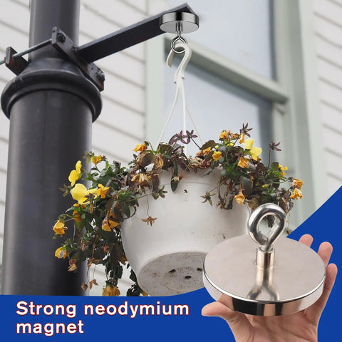 Beast Mode Neodymium Fishing Magnet With 1500 Lb Pulling Force used to hang a flower pot, demonstrating strength and size.