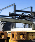 USMC M40A3 Cycling Action Airsoft Rifle in OD Green resting on a metal beam, gun only with realistic bolt cycling action