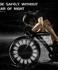 Cyclist riding at night with 48 Pcs 360 Degree Visibility Bike Spoke Reflectors Waterproof Reflective Clips for safety.