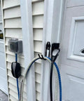 Rugged EV Charging Cable Holder Wall Mount with Anti Slip Rubber Coating securing cables on outdoor garage wall.