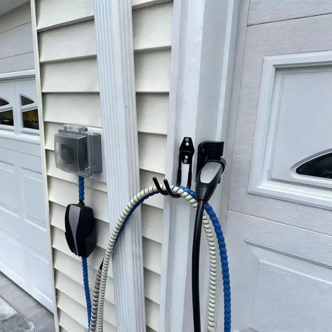Rugged EV Charging Cable Holder Wall Mount with Anti Slip Rubber Coating securing cables on outdoor garage wall.