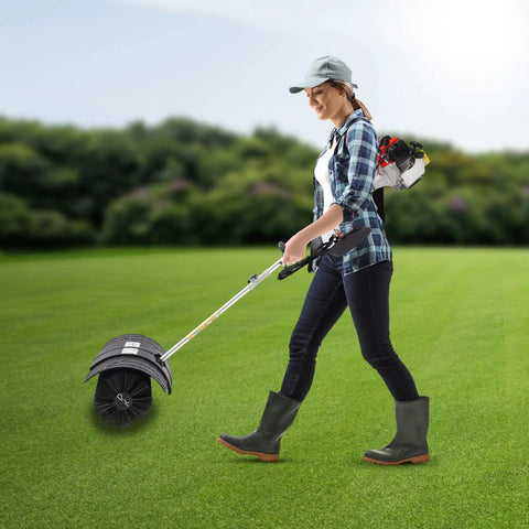 Gas Powered Handheld Sweeper Broom For Lawn Cleanup 52cc 2 Stroke Engine Two Point Three HP Portable Gasoline Powered Sweeping Machine With Fuel Tank Built To Last Durable ABS Aluminum Build Easy Start And Debris Removal, woman using it on lawn