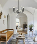 8-Light Modern Black Farmhouse Chandelier with Industrial Metal Arms and Candle-Style Cups in chic living room setup