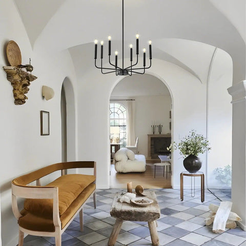 8-Light Modern Black Farmhouse Chandelier with Industrial Metal Arms and Candle-Style Cups in chic living room setup