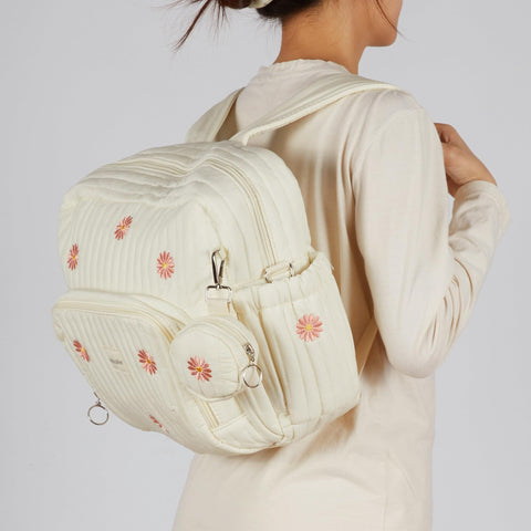 Woman wearing Diaper Bag Backpack For Moms Large Capacity Baby Travel Backpack With Changing Pad Insulated Bottle Pockets Medium Beige Floral