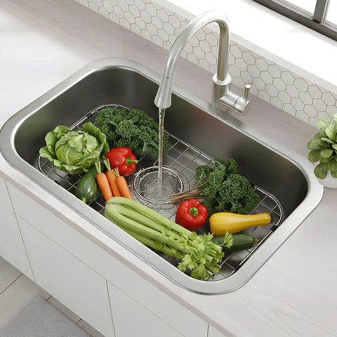 Heavy Duty Foldable Sink Protector Grid With Center Drain And Rounded Corners No Fuss Stainless Steel Drop In Sink Bottom Rack with fresh vegetables.