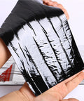 Heavy Duty Black Asphalt Crack Repair Tape held in hand, waterproof self adhesive roll, ideal for sealing roofs and decks.