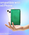Hand holding Rainbow Finish Handy Pocket Size Scale 500G By 0.01G with cellphone for size comparison