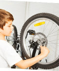 Fire Up Your Rig With This Mountain Bike Front And Rear Mechanical Disc Brake Kit Featuring Forged Aluminum Calipers Premounted Pads And Direct Pull Cables For Solid Stops On Wild Trails All Season Long, child adjusting bike brake.