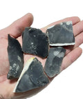 Hand holding 5 Piece Flint Fire Starter Set For Survival And Camping High Silica Flint Stones Ready To Spark