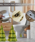 Set Of Two Green Christmas Tree Toilet Bolt Covers That Snaps Right On In Seconds And Brings Hella Cute Holiday Bathroom Decor To Any Home While Keeping Ugly Bolts Straight Outta Sight All Season Long, displayed by toilet.