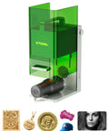 Front view of xTool F1 2-in-1 dual laser engraver with green translucent shield; desktop engraver for metal, wood, leather