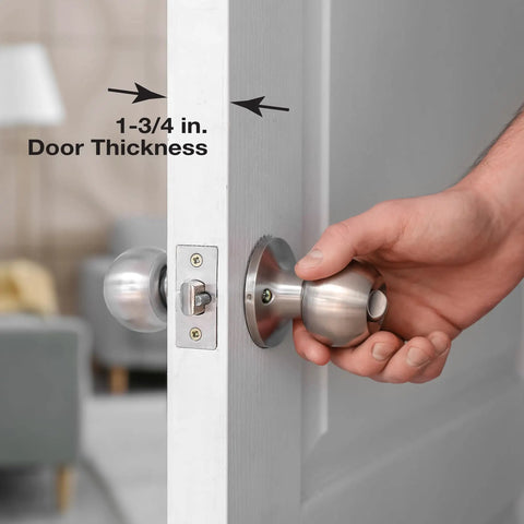 Hand installing stainless steel lock and door reinforcement plate for one and three quarter inch thick doors on white door