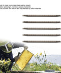 5 Piece Bee Cell Cups Kit For Queen Rearing with plastic bars and beekeeper at work in field.