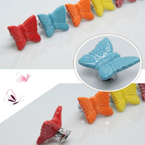 Colorful ceramic butterfly cabinet knobs set on display with close-up detail and multiple colors. Product focus: Ceramic Butterfly Cabinet Knobs Set Pink, 6 Pack Vintage Drawer Pulls For Dresser, Wardrobe, Cupboard, And Kitchen Cabinets, 3 Size Screws Included, Elegant European Style Decor.