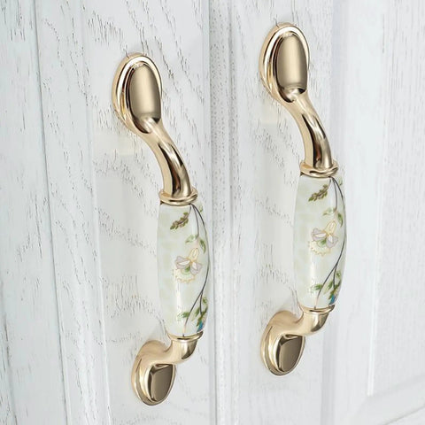 Ceramic Door Knobs Set, 2 Pcs Retro Furniture Handle, Vintage Antique Drawer Pulls Cupboard Knob, Cabinet Pull Handles, Zinc Alloy With Ceramic Accent, 3-3/4 Inch Hole Centers shown mounted on white cabinet doors.