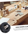 Woodworking T Slot Clamp Quick Release Hold Down Tool For T Track Carpentry Positioning And Workpiece Fixing Heavy Duty Clamping Jig Pro Grade For Sawmills Routers Drill Presses Benchtop Projects on a woodworking bench.