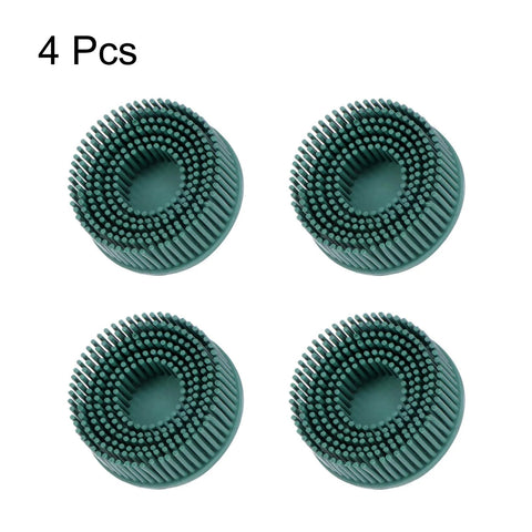 Front view of four green 2-inch bristle discs, 50 grit abrasive brushes for metal deburring.