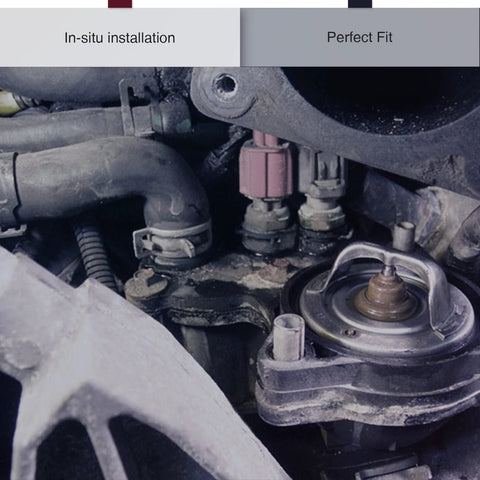 Engine coolant temperature sensor in a dusty car engine bay with pink electrical connector.