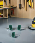 Versatile 2 Pc Mushroom Buffing Wheels With Handle For Drill on workspace, showcasing nylon and stainless steel pads for rust removal.