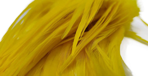 Close-up of Yellow Saddle Hackle Feathers For Fly Tying Pro Grade Pack Of Four To Six Inch Rooster Feathers Mixed Colors For Crafting