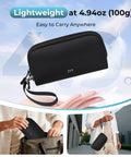 Grab-And-Go Travel Cable Organizer With 8 Compartments, Water-Resistant Tech Pouch With Wrist Strap, shown in black in use and being held.