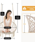 Woman sitting on Cozy Hammock Chair Set Of 2 Macrame Swing Chairs With Tassels Bohemian Style Handwoven Cotton Rope Indoor Outdoor Beige