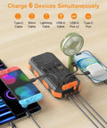 Portable Solar Power Bank 38800mAh With PD 22.5W USB C Fast Charging Four Built In Cables Dual LED Emergency Flashlights connected to devices
