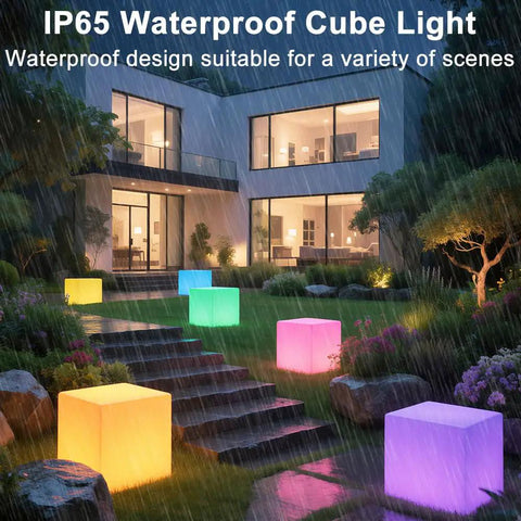 Lit RGB Color Changing LED Cube Seat 14-Inch LED Cube Chair illuminating garden steps in rain, showcasing waterproof feature