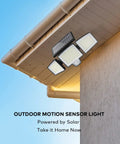 Solar Motion Sensor Outdoor Flood Lights With Remote Control, mounted on a house, showcasing 3 heads and solar panel.