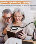 Couple reading with USB Clip On Handy Magnifier Lamp With 3.2 Inch Lens And 62 High CRI LEDs 10X Magnification by sofa