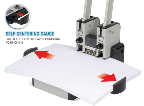 Heavy Duty Two Hole Paper Punch For 100 Sheets Of Paper With Hollow Core Technology and Samurai Steel Heads in use with self-centering gauge.