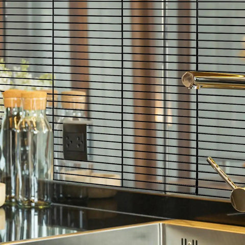 Stainless Steel Peel And Stick Backsplash Kit With 10 Sheets, Polished Silver Subway Brick Tiles in a kitchen setting.