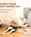 Handy Dandy Two In One Spoon Rest And Pot Lid Holder For Kitchen Counter with ceramic lid, stainless steel rack and spoons.