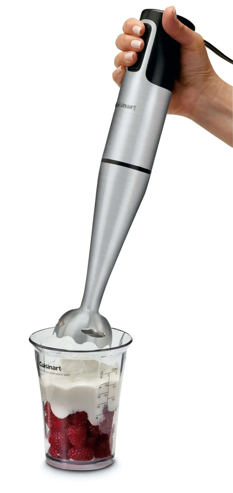 Slick 200 Watt Immersion Hand Blender With Brushed Stainless Steel Build blending ingredients in a clear beaker.