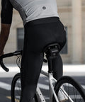 Cyclist riding with a compact under seat bike saddle bag for road bikes ultra lightweight with multi pocket storage 0.35L capacity