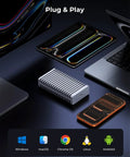 Zero Bottleneck M2 Nvme Enclosure With Slick Aluminum Double Sided Heatsink For Blazing 40Gbps Speeds on desk with multiple devices.
