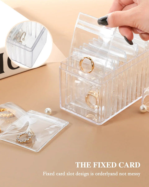 Clear Acrylic Jewelry Box Organizer With 20 Anti Tarnish Bags displaying rings, showcasing compact and tidy storage