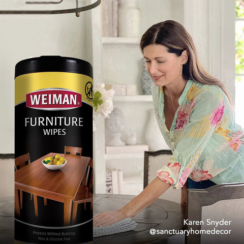 Clean Sweep Wood Polish And Cleaning Wipes For Furniture And Cabinets Lifts Off everyday grit on a dining table, with a woman using a microfiber cloth.