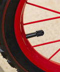 Ride Ready 20 Pack Tire Valve Stem Caps on bike wheel, showing universal plastic dustproof waterproof covers black