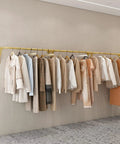 Industrial Wall Mounted Clothing Rack For Laundry And Retail 300cm showing garments on heavy duty steel rod organizer