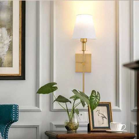 Battery Operated Wall Sconces Set Of 2 Gold Wireless LED Wall Lights With Remote Dimmable 10 Color Modes Rechargeable Indoor Sconce Fixture For Bedroom Apartment Farmhouse Decor No Wiring Needed, gold sconce on wall above table with plant and frames