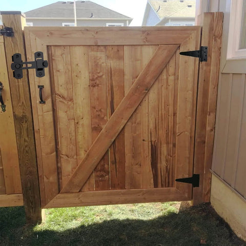 Wooden gate with self-closing gate latch kit, tee hinge, 4-inch T-strap hinges in black finish. Ideal for wood or vinyl fences.