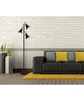 Modern living room with black sofa, yellow cushions, and Dual Bulb Desk Lamp With Brushed Steel Base And Black Shade