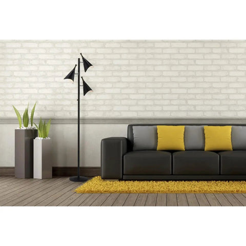 Modern living room with black sofa, yellow cushions, and Dual Bulb Desk Lamp With Brushed Steel Base And Black Shade