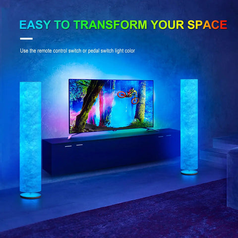 Lit 52 Inch Slim Modern Floor Lamp With RGB Color Changing Tyvek Fabric Shade beside TV in living room