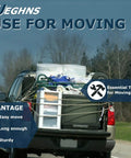 Truck loaded with moving boxes using a telescopic truck bed cargo grabber reach retriever tool for efficient loading.