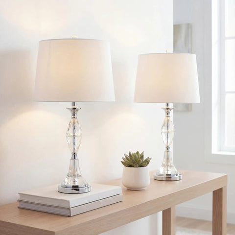 Crystal Glass Table Lamps Set Of 2 With Clear Chrome Finish, White Linen Drum Shade on wooden table in modern room