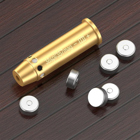 Red Laser Bore Sight For .357 Magnum And .38 Special with brass body and batteries on wooden surface