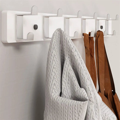 Slick Modern Wall Mounted Coat Rack In Brushed Brass With Heavy Duty Hooks For Entryway Living Room Or Kitchen To Hold Jackets Bags Hats And Umbrellas No Fuss Ever Durable Finish Looks Sharp While Sorting Daily Items Straight Up, featuring gray and brown items hanging.